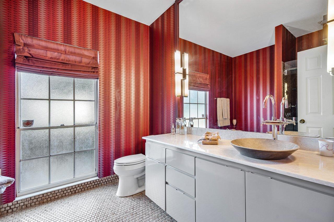 169 Apollo Circle Jupiter, FL 33477 - Photo 19 of 54 a bathroom with a sink a toilet and shower