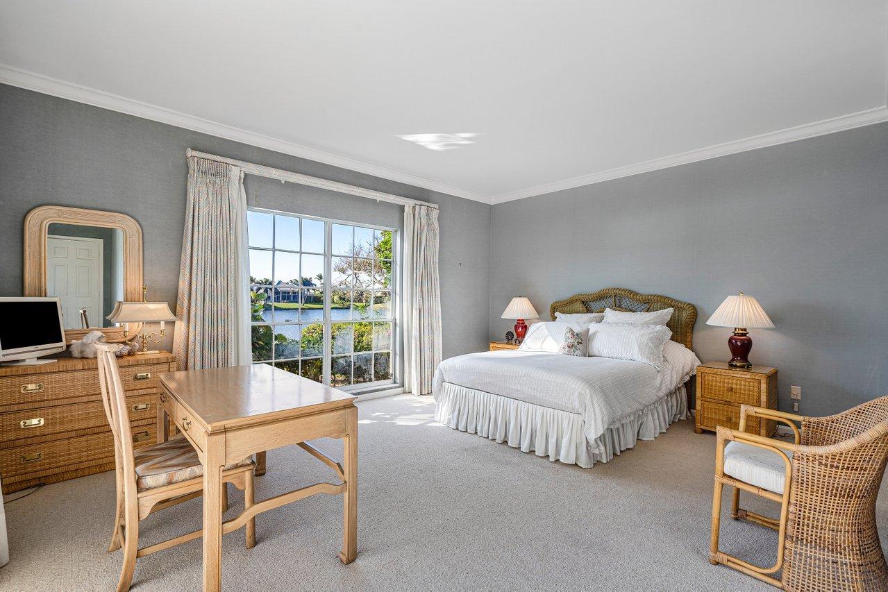 169 Apollo Circle Jupiter, FL 33477 - Photo 21 of 54 a bedroom with bed and a large window