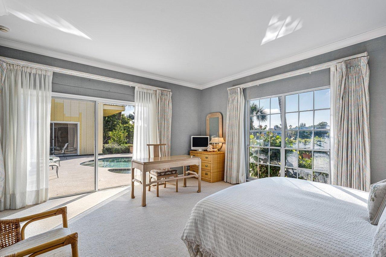 169 Apollo Circle Jupiter, FL 33477 - Photo 22 of 54 a bedroom with furniture and a window