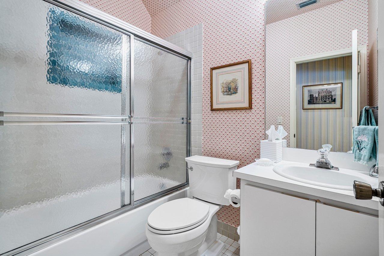 169 Apollo Circle Jupiter, FL 33477 - Photo 27 of 54 a bathroom with a toilet a sink and shower