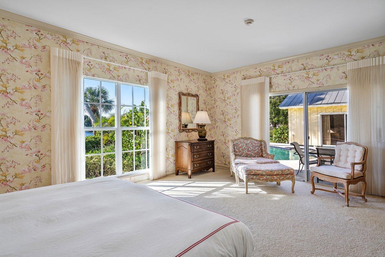 169 Apollo Circle Jupiter, FL 33477 - Photo 29 of 54 a bedroom with a bed and a large window