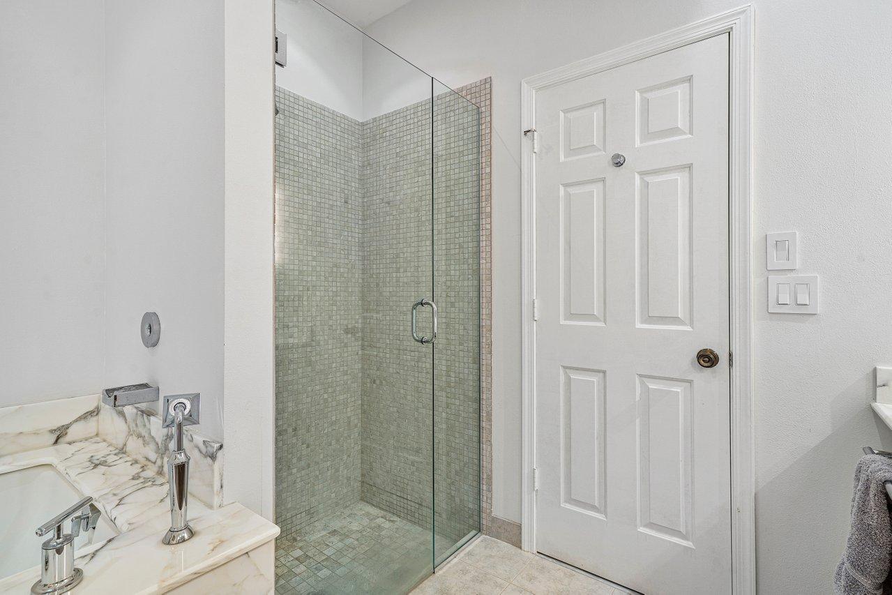 169 Apollo Circle Jupiter, FL 33477 - Photo 31 of 54 a bathroom with a bathtub shower sink and toilet