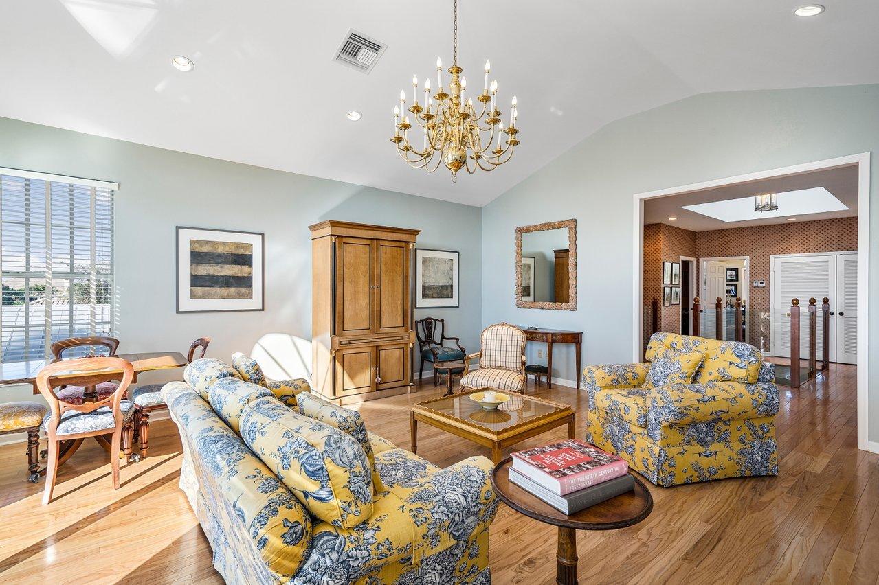 169 Apollo Circle Jupiter, FL 33477 - Photo 33 of 54 a living room with furniture a dining table and a window