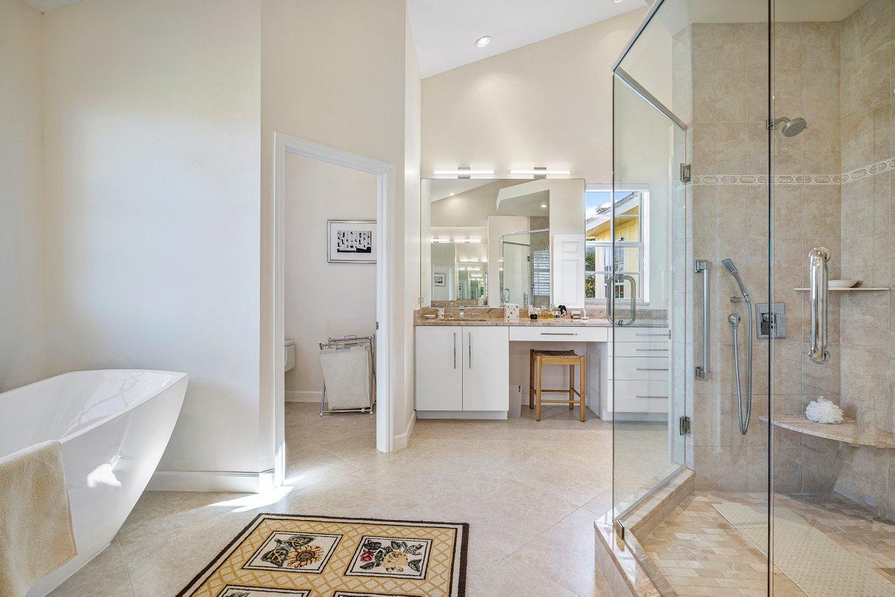 169 Apollo Circle Jupiter, FL 33477 - Photo 41 of 54 a bathroom with a sink a toilet and shower