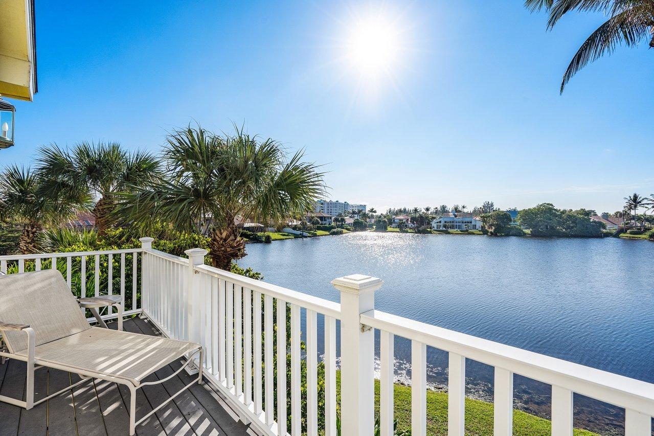 169 Apollo Circle Jupiter, FL 33477 - Photo 43 of 54 a view of a deck with two chair and wooden floor