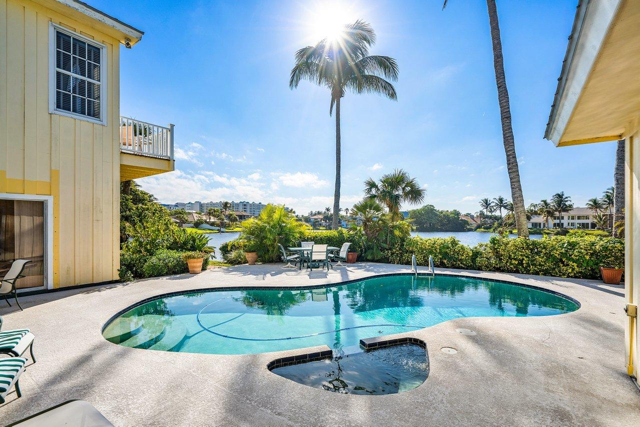169 Apollo Circle Jupiter, FL 33477 - Photo 47 of 54 a view of a swimming pool with a potted plants