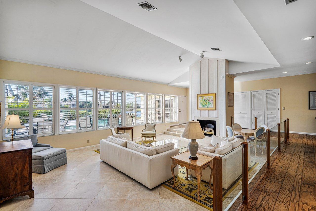 169 Apollo Circle Jupiter, FL 33477 - Photo 6 of 54 a living room with fireplace furniture and a large window