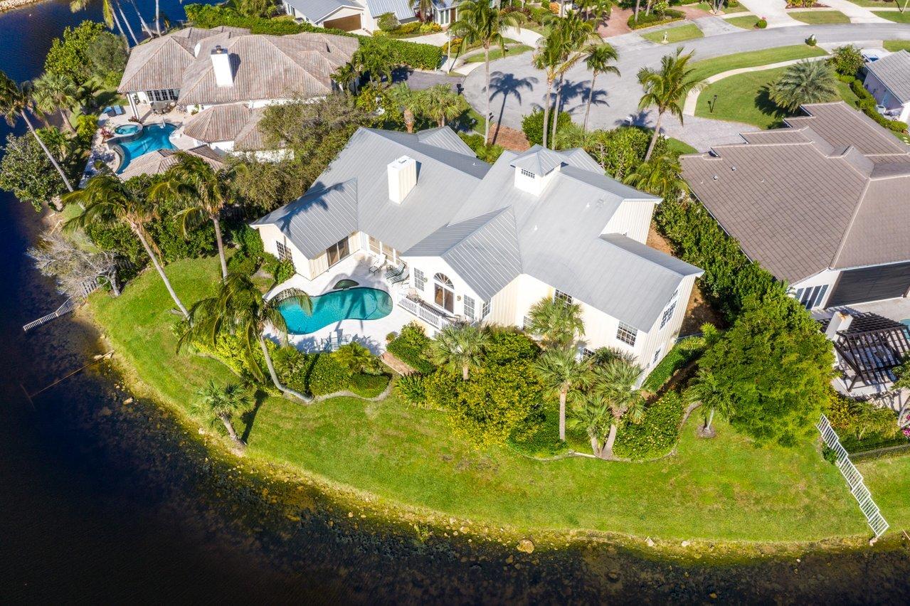 169 Apollo Circle Jupiter, FL 33477 - Photo 51 of 54 an aerial view of a residential houses with yard