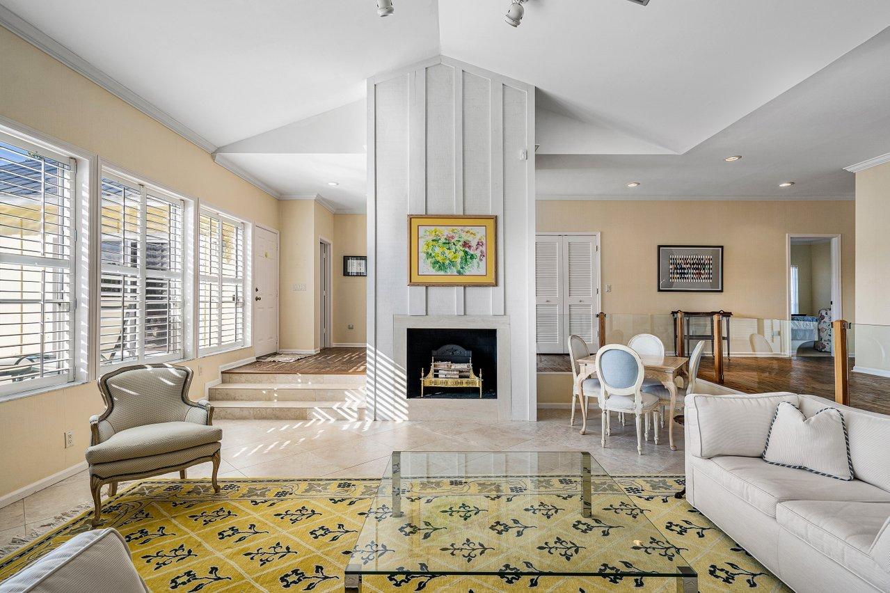 169 Apollo Circle Jupiter, FL 33477 - Photo 7 of 54 a living room with furniture a fireplace and window