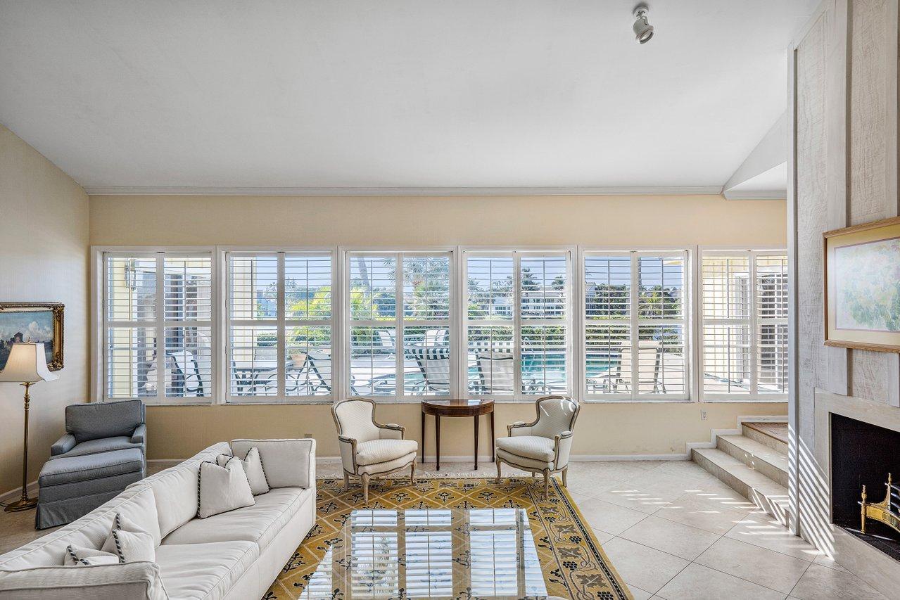 169 Apollo Circle Jupiter, FL 33477 - Photo 8 of 54 a living room with furniture and a floor to ceiling window