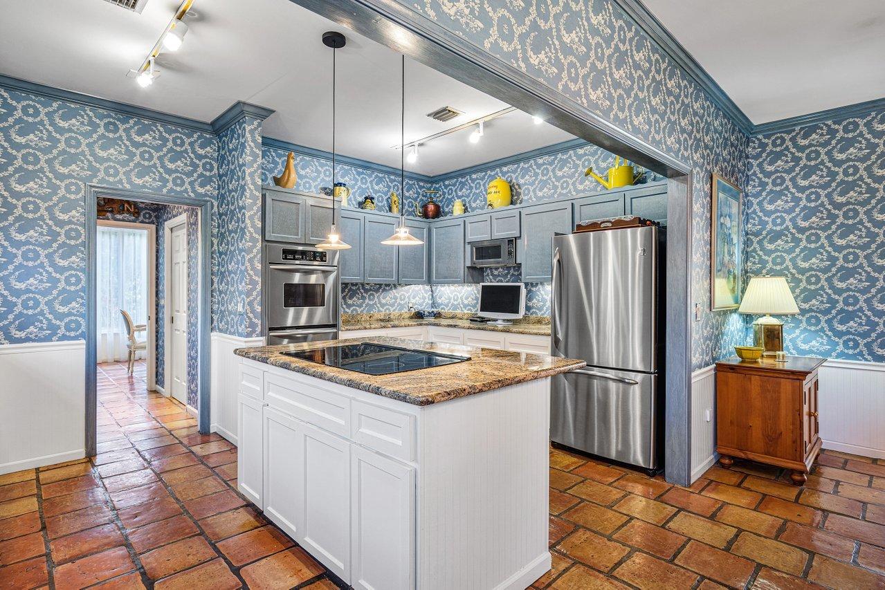 169 Apollo Circle Jupiter, FL 33477 - Photo 10 of 54 a kitchen with stainless steel appliances granite countertop a refrigerator a sink and a stove