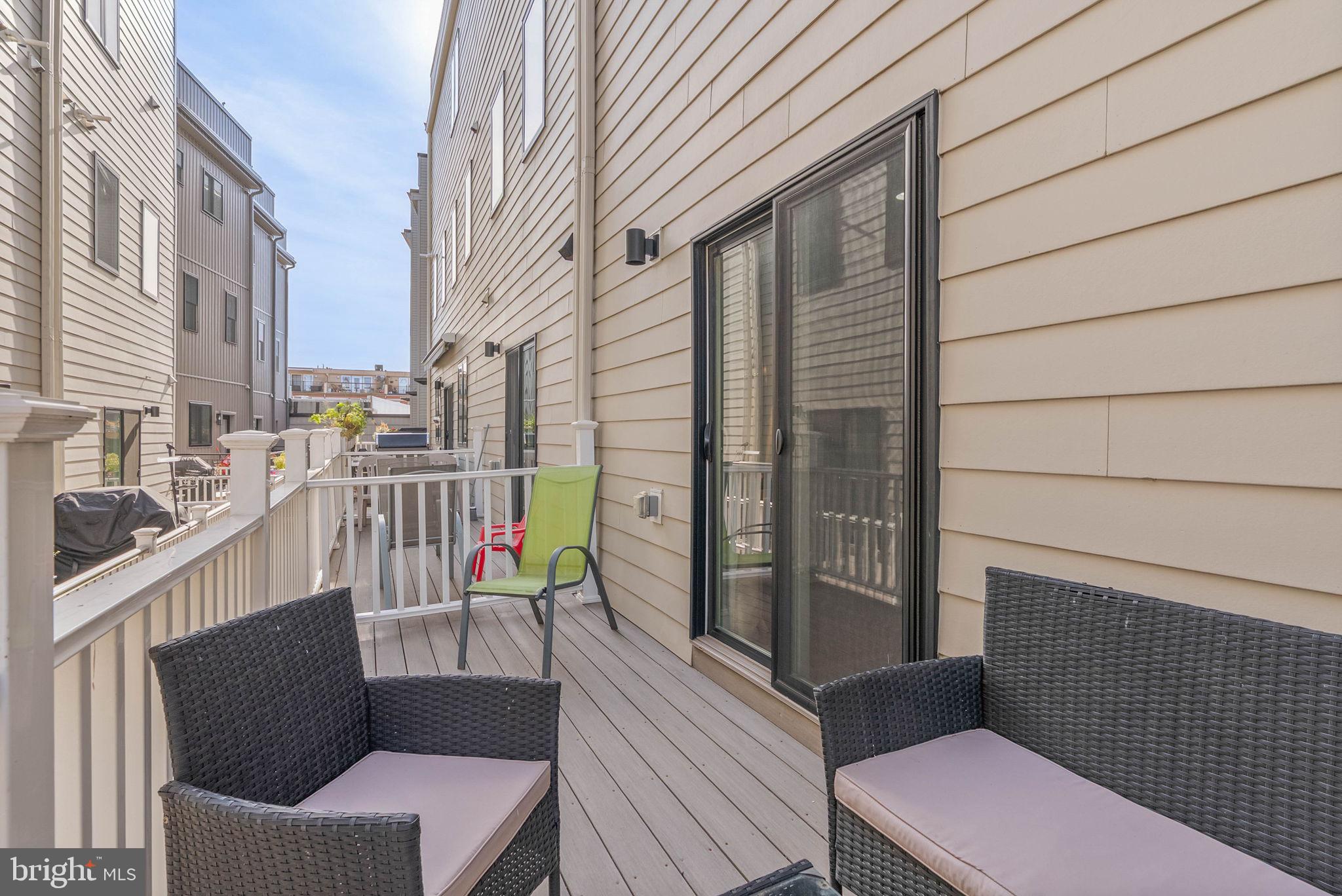 1423 South Howard Street Philadelphia, PA 19147 - Photo 23 of 40 a view of a balcony with wooden chairs