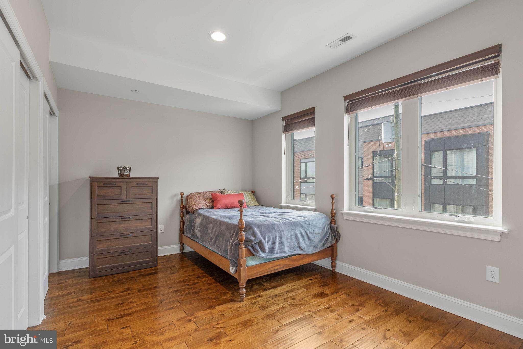 1423 South Howard Street Philadelphia, PA 19147 - Photo 29 of 40 a bedroom with a bed and a window