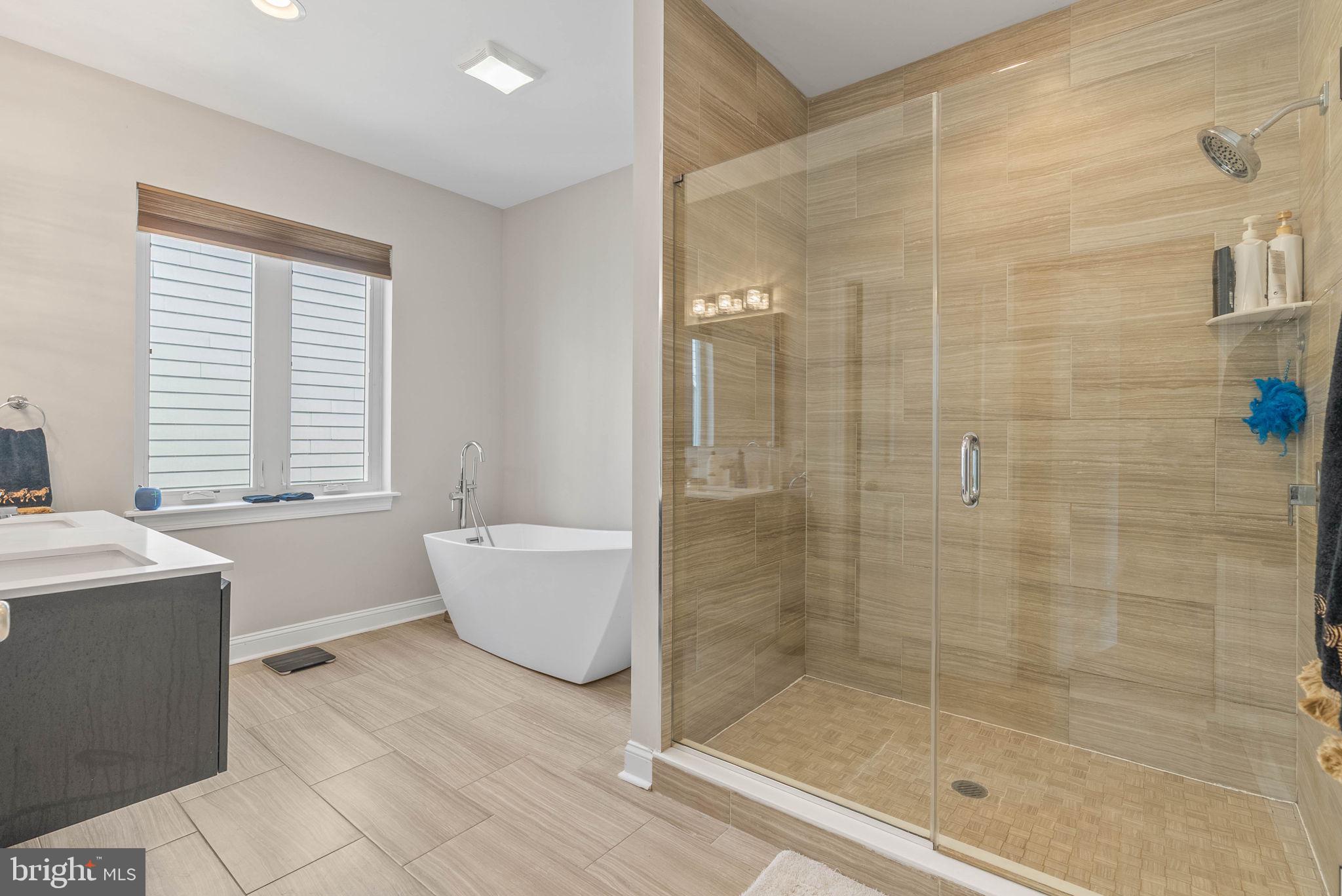 1423 South Howard Street Philadelphia, PA 19147 - Photo 35 of 40 a bathroom with a bathtub a sink and a shower
