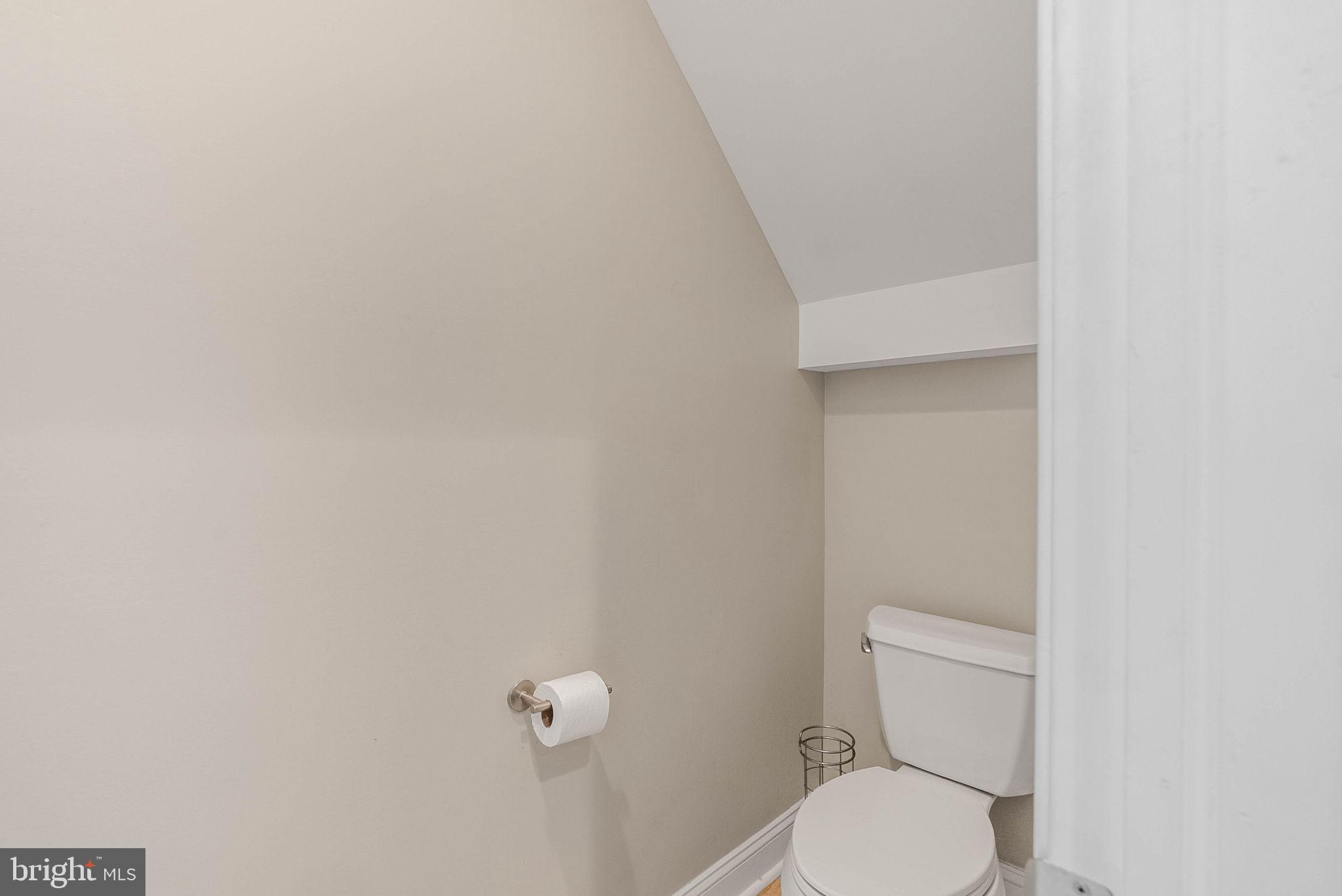 1423 South Howard Street Philadelphia, PA 19147 - Photo 37 of 40 a white toilet sitting next to a white wall