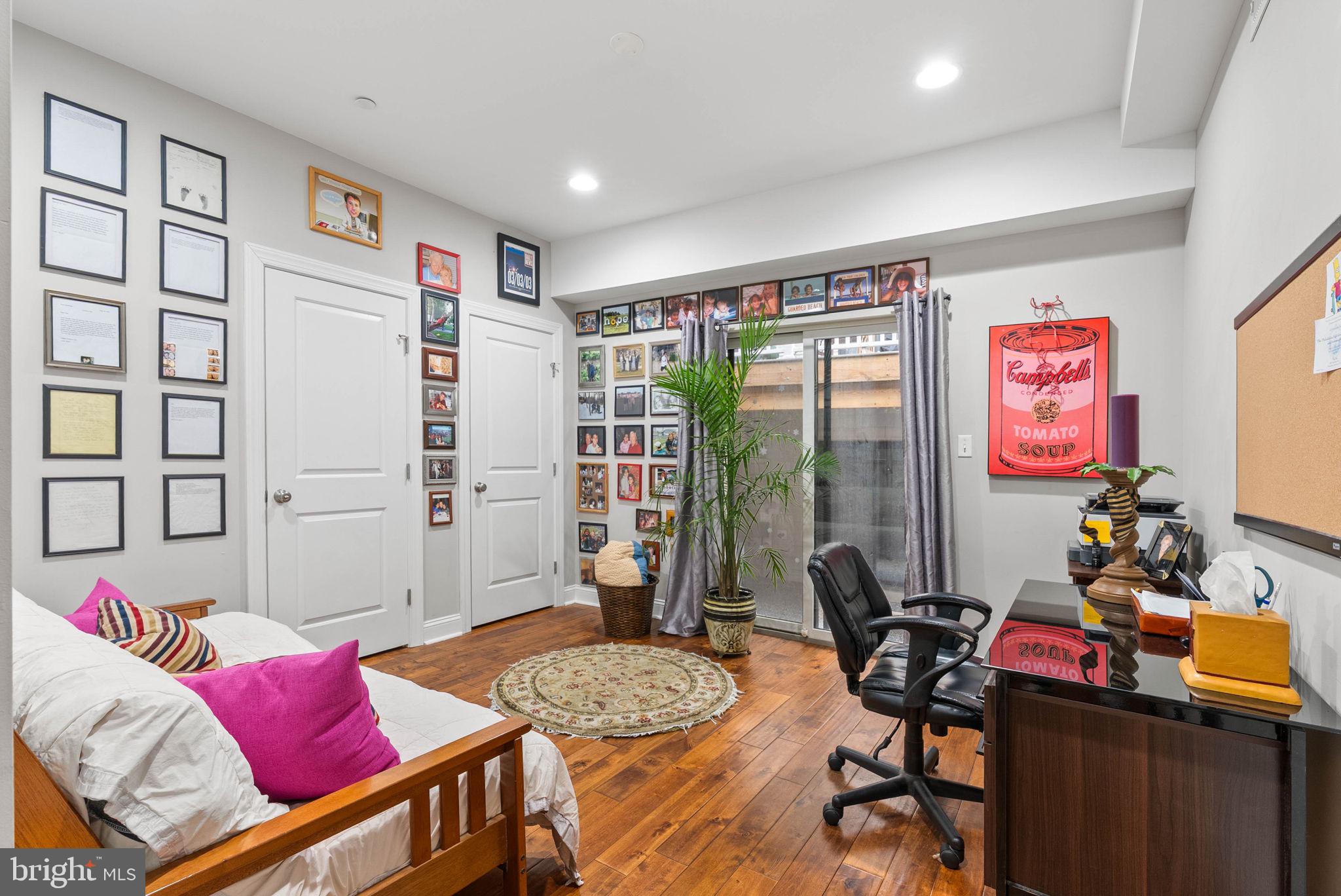 1423 South Howard Street Philadelphia, PA 19147 - Photo 8 of 40 a living room with furniture and a flat screen tv
