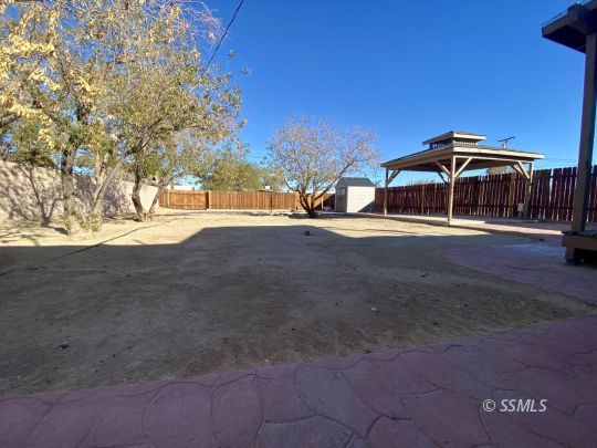 244 North Alvord Street Ridgecrest, CA 93555 - Photo 21 of 21 a view of a house with a yard