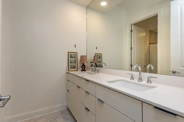 a kitchen with stainless steel appliances granite countertop a stove and a wooden floors