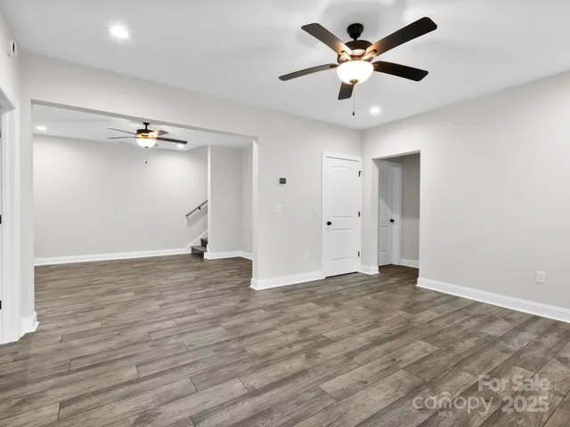 a bathroom with a granite countertop sink a toilet and a bathtub
