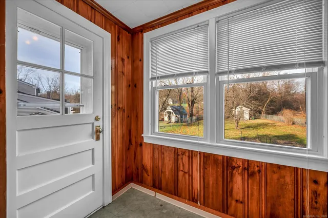 a view of a door and a window