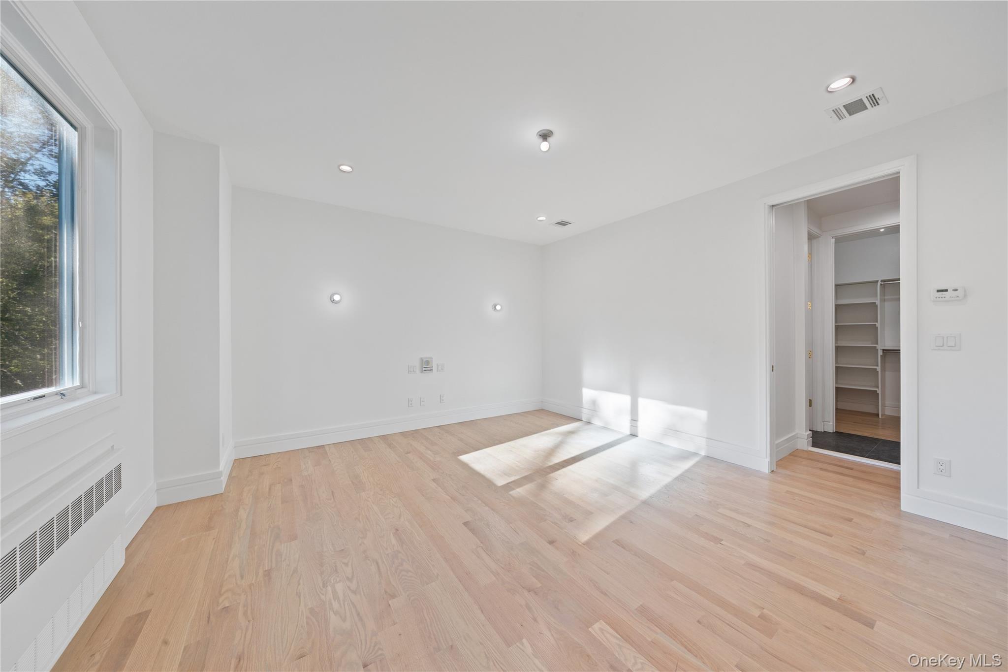 40 Singer Avenue, Unit 214 Spring Valley, NY 10977 - Photo 19 of 49 a view of empty room with wooden floor