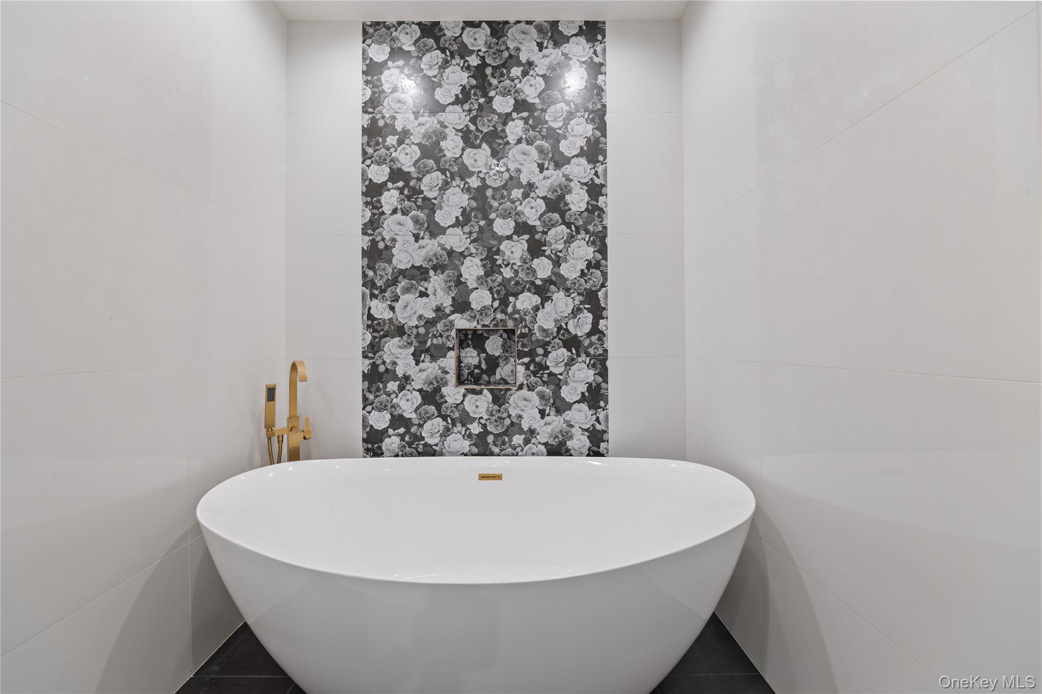 40 Singer Avenue, Unit 214 Spring Valley, NY 10977 - Photo 22 of 49 a white bath tub sitting in a bathroom