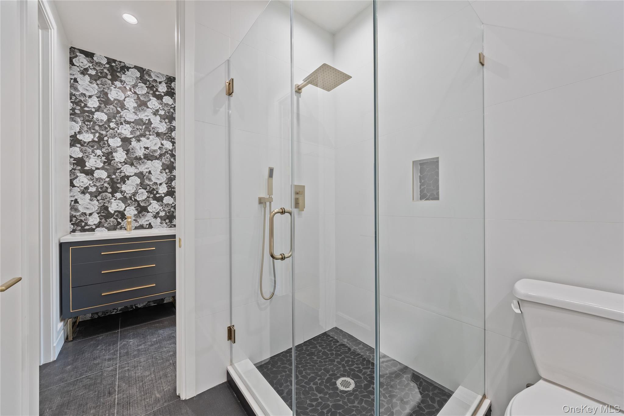 40 Singer Avenue, Unit 214 Spring Valley, NY 10977 - Photo 24 of 49 a bathroom with a granite countertop sink toilet and shower