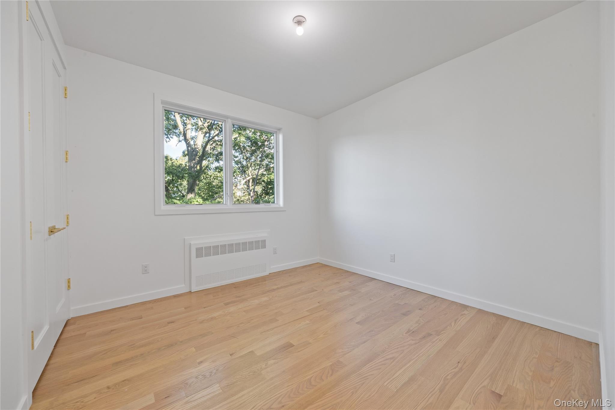 40 Singer Avenue, Unit 214 Spring Valley, NY 10977 - Photo 29 of 49 an empty room with a window