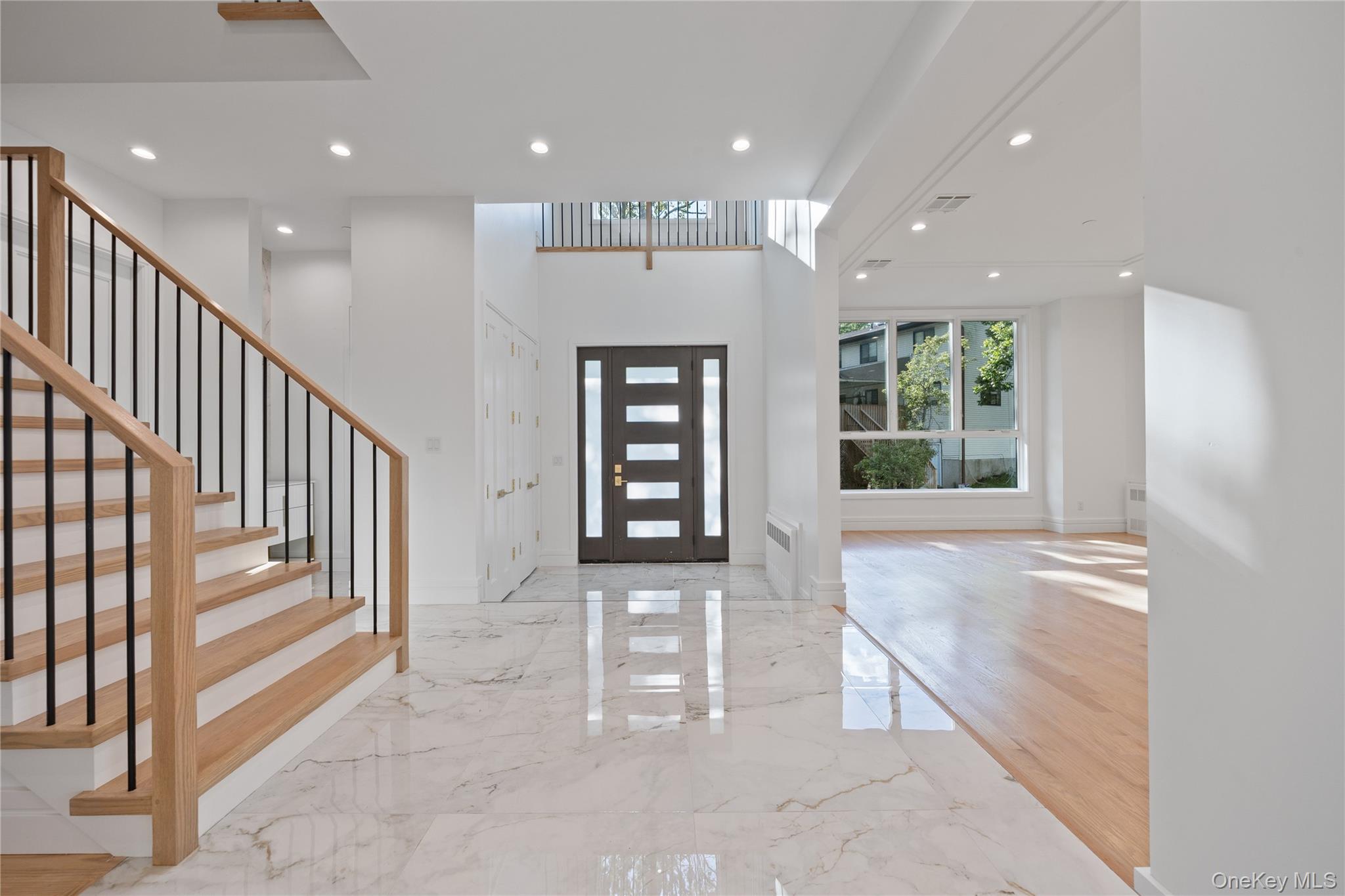 40 Singer Avenue, Unit 214 Spring Valley, NY 10977 - Photo 3 of 49 a view of an entryway with wooden floor and windows