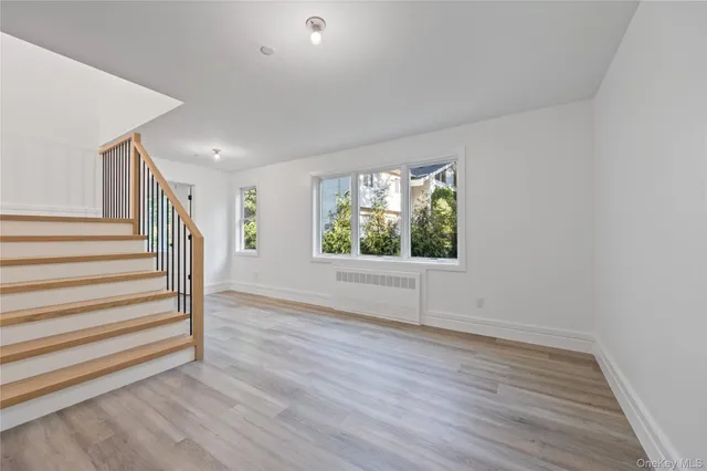 a large white kitchen with white cabinets