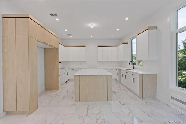 a kitchen with sink and cabinets