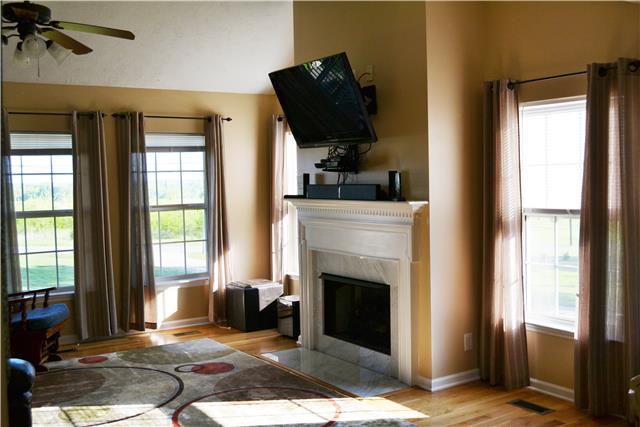 477 Rome Pike Lebanon, TN 37087 - Photo 3 of 14 Living Room with Vaulted Ceiling, Ceiling Fan, Lots of Light Hardwood Floors, & Gas Fireplace