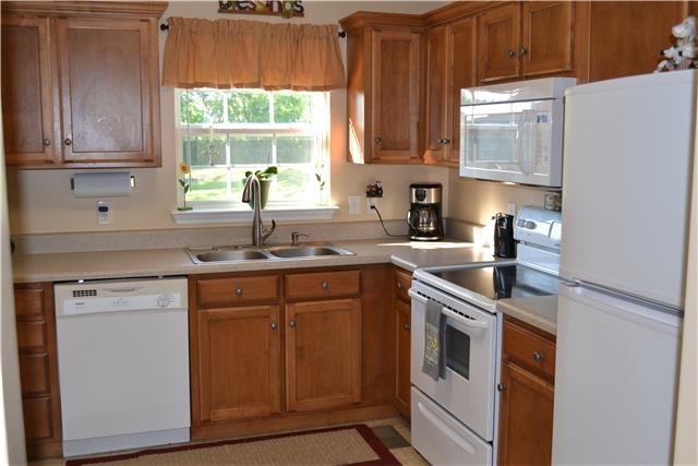 477 Rome Pike Lebanon, TN 37087 - Photo 6 of 14 Nice kitchen with new lighting, new faucet, new garbage disposal, smooth top stove, microwave and refrigerator.