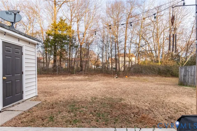 a backyard of a house with lots of green space