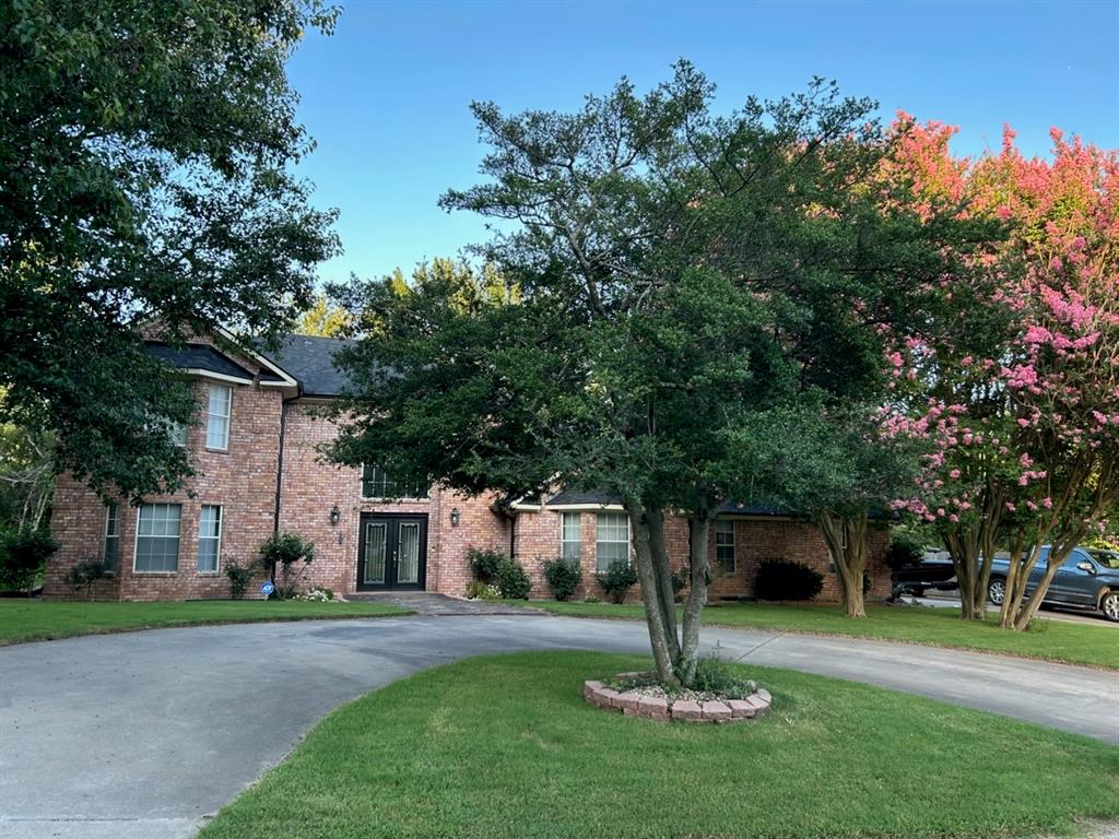 2020 Arbor Bend Road Bonham, TX 75418 - Photo 1 of 40 Traditional brick exterior with a black shingled roof and prominent double entry doors