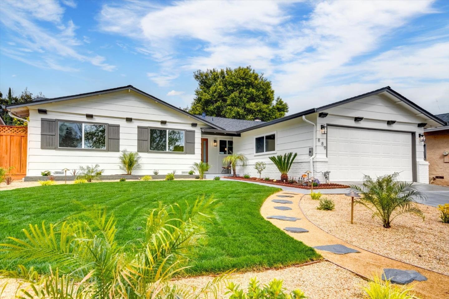 889 Raintree Court San Jose, CA 95129 - Photo 1 of 1 a front view of a house with a yard