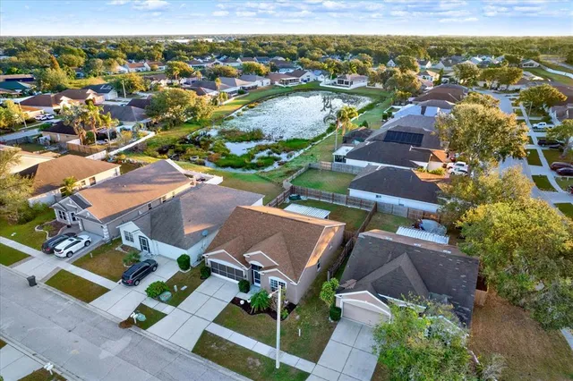 an aerial view of residential houses with outdoor space