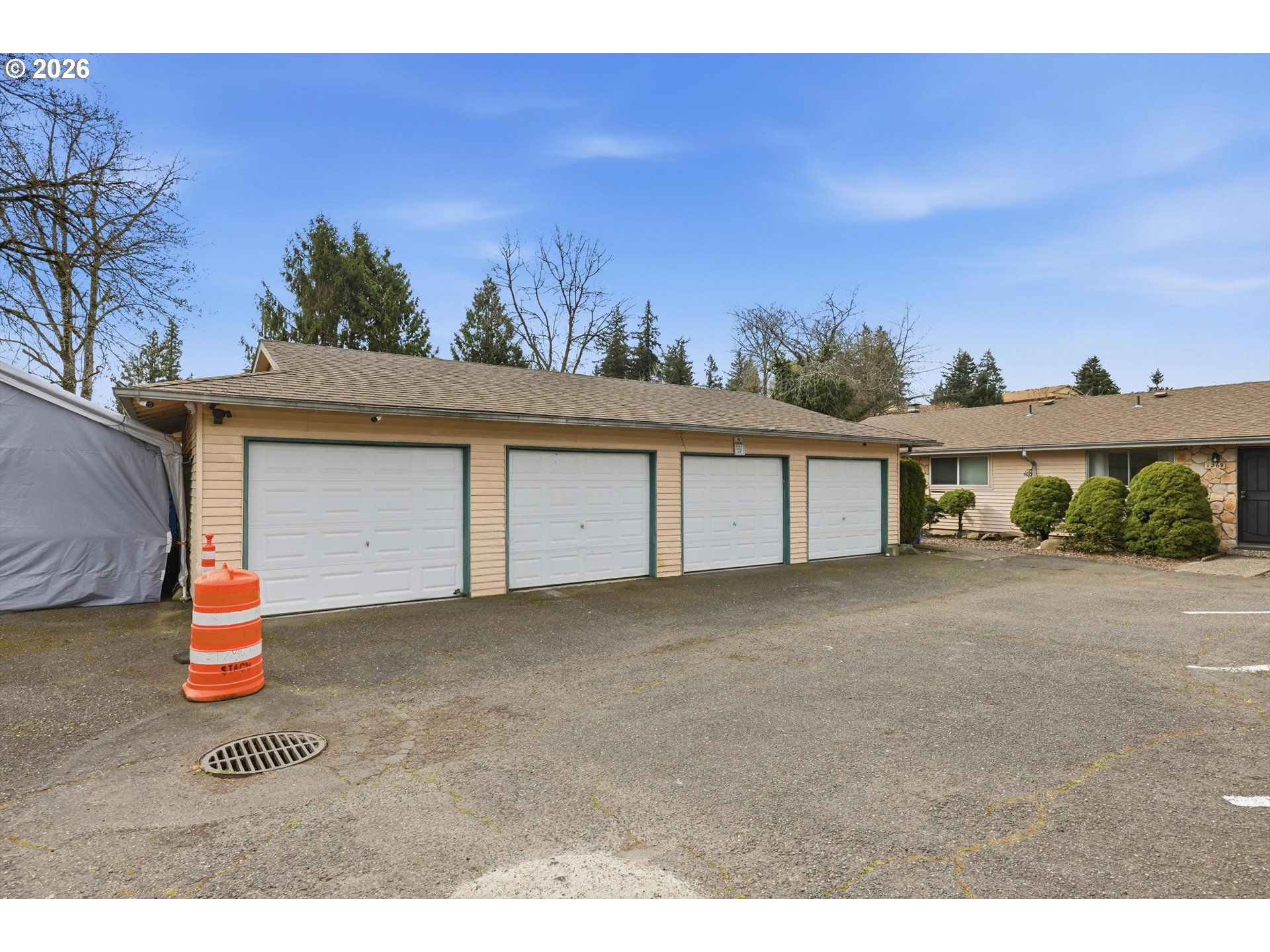 1267 Northeast 183rd Avenue Portland, OR 97230 - Photo 24 of 34 a front view of a house with a yard and garage