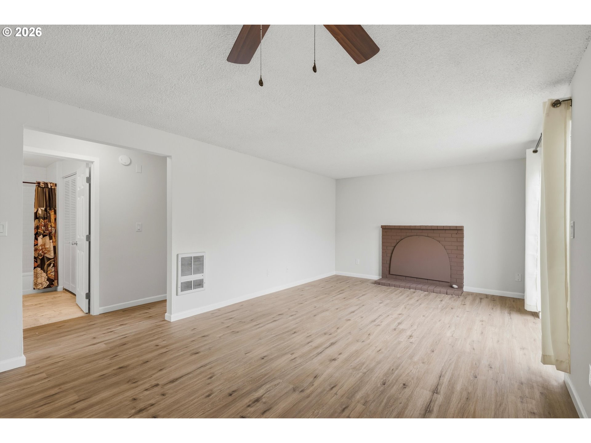 1267 Northeast 183rd Avenue Portland, OR 97230 - Photo 5 of 34 a view of an empty room with wooden floor