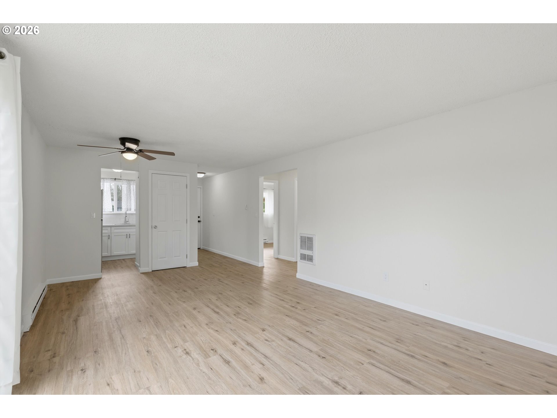 1267 Northeast 183rd Avenue Portland, OR 97230 - Photo 7 of 34 a view of an empty room with wooden floor