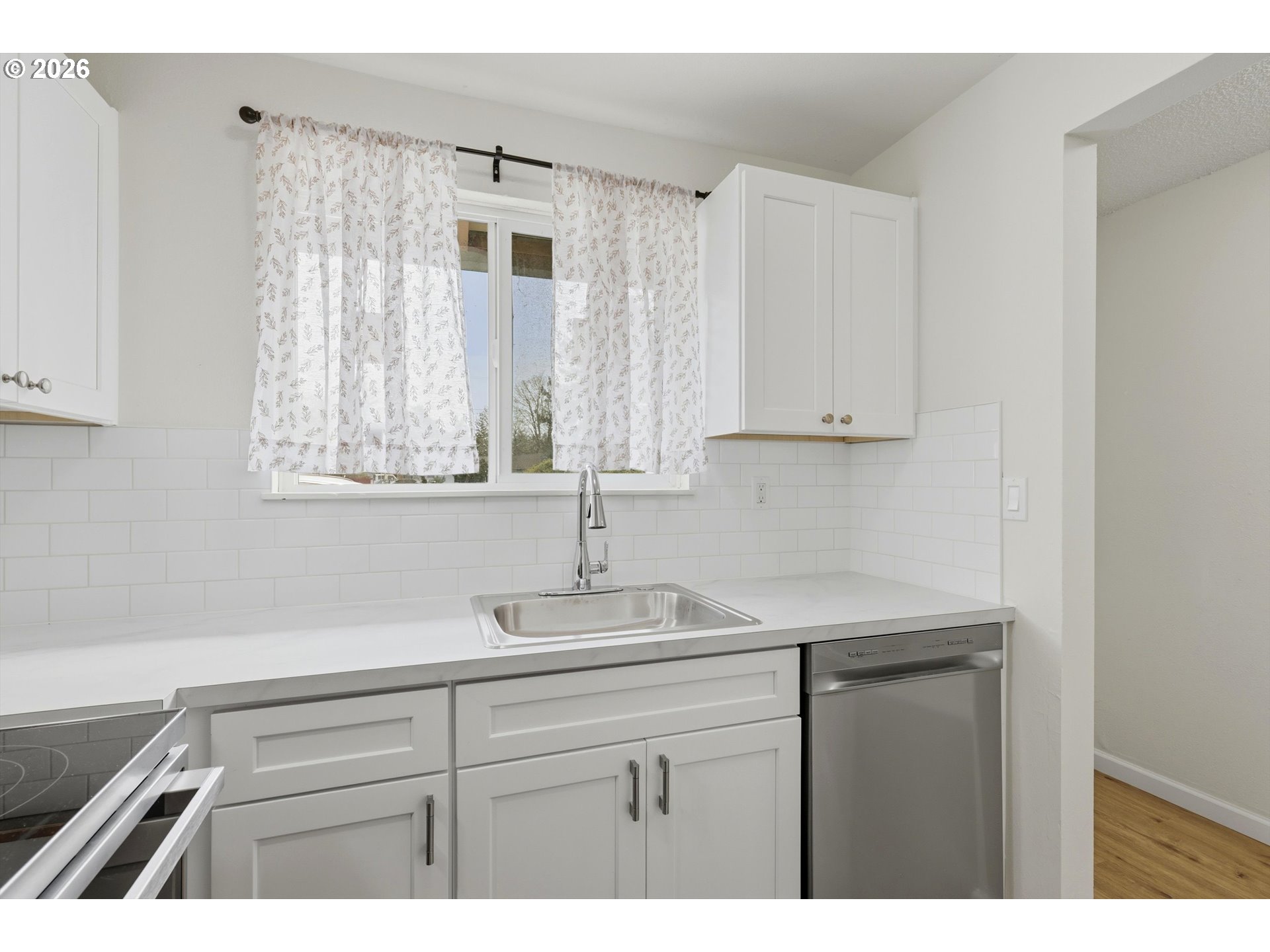 1267 Northeast 183rd Avenue Portland, OR 97230 - Photo 10 of 34 a kitchen with a sink and cabinets
