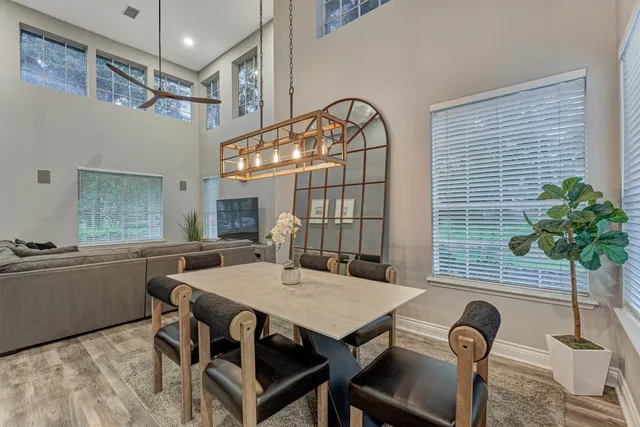 a view of a dining room with furniture window and wooden floor