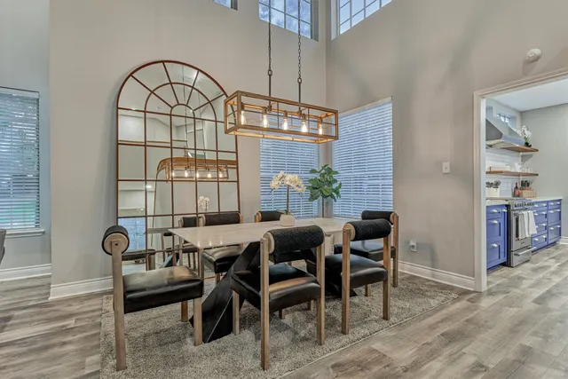a view of a dining room with furniture window and outside view