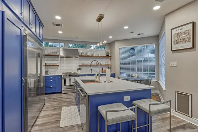 a kitchen with a sink appliances and a counter top space