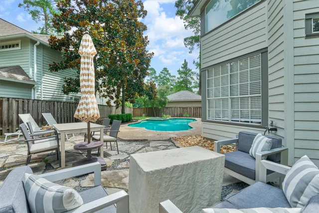 a view of an outdoor sitting area with furniture
