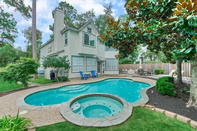 a view of a swimming pool with a patio
