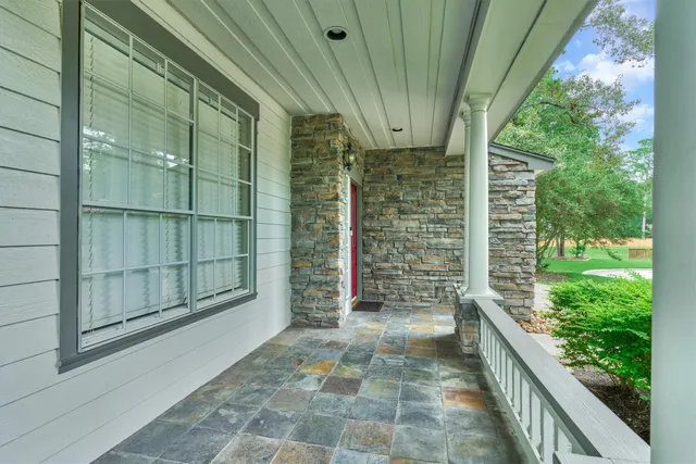 a view of a balcony with door