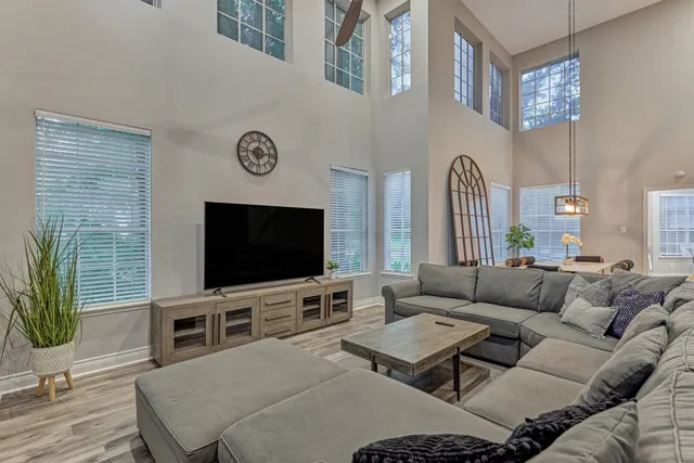 a living room with furniture and a flat screen tv