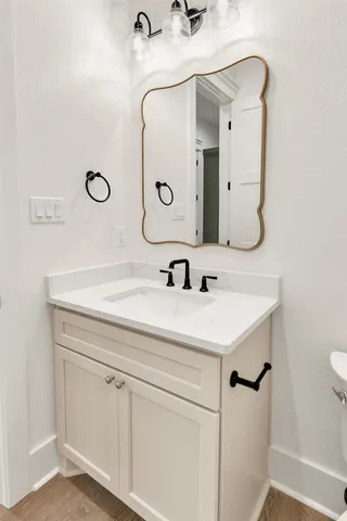 a bathroom with a sink and a mirror