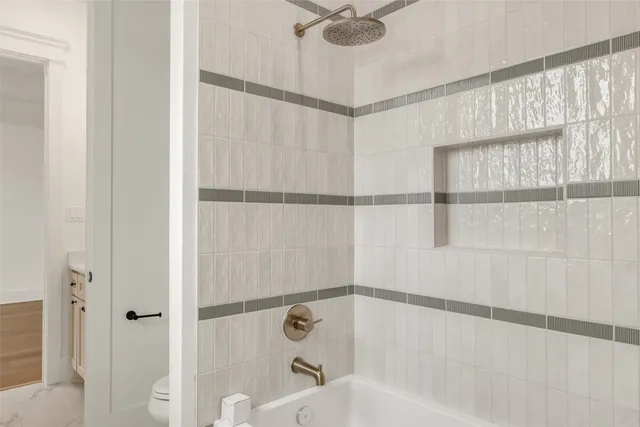 a bathroom with a shower and a shower